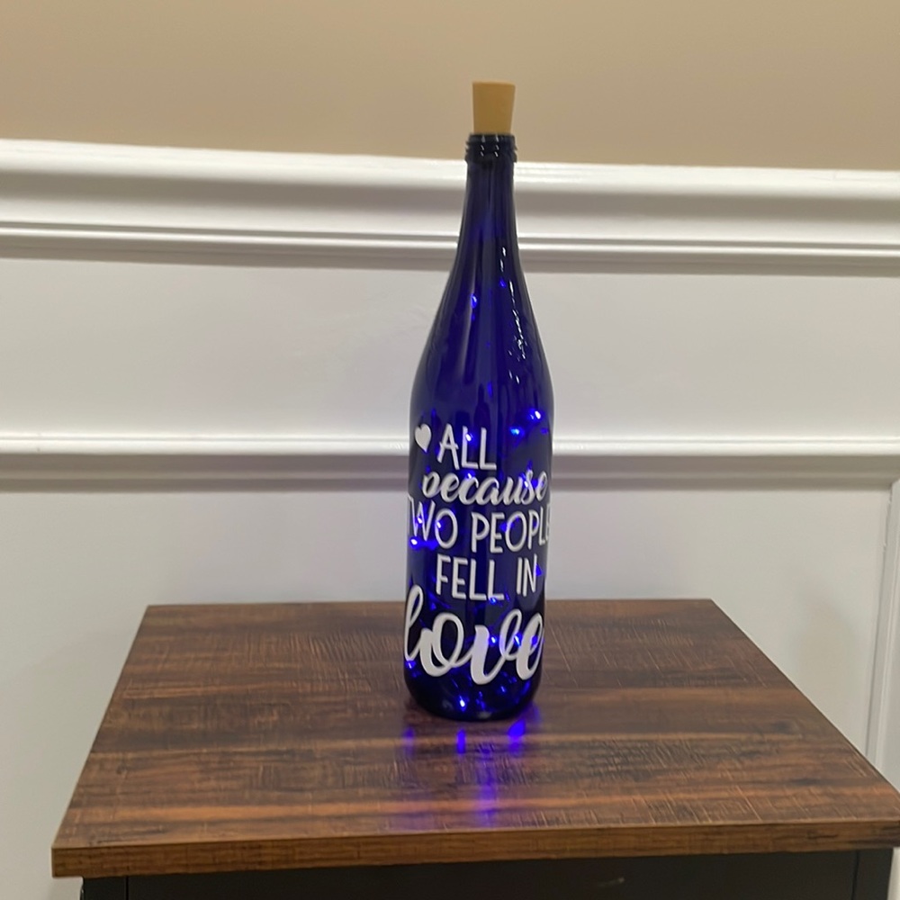 {All Because Two People Fell in Love} Handmade blue light up bottle